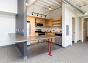 Thumbnail 10 of 42 - a large kitchen with a large table in the middle at Eagle View Lofts, Iowa, 50309