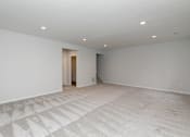 Thumbnail 5 of 21 - an empty living room with white walls and a tile floor at Two Rivers Home Rentals, West Des Moines, Iowa