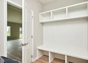 Thumbnail 12 of 21 - an empty room with a white closet and a door at Two Rivers Home Rentals, West Des Moines, IA