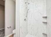 Thumbnail 13 of 21 - A white bathroom with a marble shower. at Two Rivers Home Rentals, West Des Moines, IA 50266