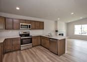 Thumbnail 21 of 21 - a kitchen with a stove and a sink at Two Rivers Home Rentals, West Des Moines, 50266