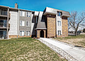 Thumbnail 30 of 33 - an apartment building with a sidewalk in front of it at Penbrooke Place Apartments, South Dakota