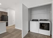 Thumbnail 17 of 52 - A kitchen with a white oven and microwave.