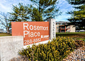Thumbnail 49 of 90 - a sign for rosemont place in front of a building at Rosemont Place Apartments, Des Moines