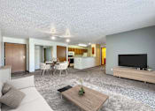 Thumbnail 2 of 40 - a living room with a couch and a tv at Autumn Park, Sioux Falls  