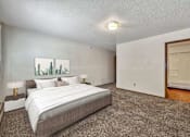 Thumbnail 6 of 40 - a bedroom with a bed and a door to a closet at Autumn Park, South Dakota  