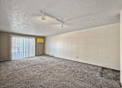Thumbnail 33 of 40 - an empty living room with blinds on the window at Autumn Park, Sioux Falls South Dakota  