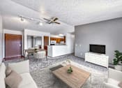 Thumbnail 7 of 40 - a living room with a couch and a table at Autumn Park, South Dakota, 57106