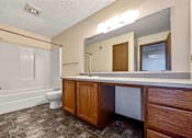 Thumbnail 12 of 40 - a bathroom with a sink toilet and a mirror at Autumn Park, South Dakota, 57106