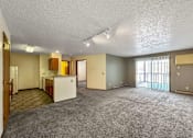 Thumbnail 15 of 40 - the living room and kitchen of an empty apartment at Autumn Park, Sioux Falls, 57106  