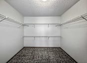 Thumbnail 30 of 40 - the walk in closet of an empty room with shelves at Autumn Park, South Dakota, 57106