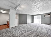 Thumbnail 31 of 40 - the living room is empty of furniture and has a sliding glass door at Autumn Park, Sioux Falls, SD 57106  