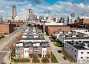 Thumbnail 22 of 37 - A cityscape with a mix of residential and commercial buildings.