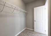 Thumbnail 10 of 37 - A white door is in a room with a white wall and a carpet.