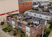 Thumbnail 23 of 37 - A view of a residential area with houses and cars.