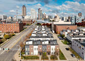 Thumbnail 37 of 37 - A cityscape with a mix of residential and commercial buildings.