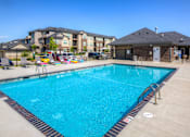 Thumbnail 29 of 50 - our resort style swimming pool is next to our building with our apartments in the background at Stonegate Crossing Apartments, Clive, IOWA
