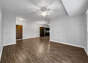 Thumbnail 20 of 50 - an empty living room with a ceiling fan at Stonegate Crossing Apartments, Clive, IA