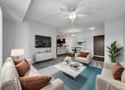 Thumbnail 6 of 50 - a living room with couches and a coffee table at Stonegate Crossing Apartments, Clive, IA, 50325