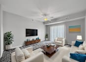 Thumbnail 7 of 50 - a living room with couches and a coffee table at Stonegate Crossing Apartments, IOWA