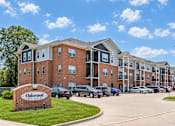 Thumbnail 3 of 12 - A large brick building with the name Oakwood on it.