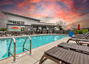 Thumbnail 8 of 13 - our apartments have a large swimming pool and lounge chairs at Lake Shore Place Apartments, Ankeny, Iowa