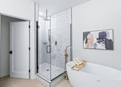 Thumbnail 7 of 77 - Spa bathroom with freestanding tub and glass shower at The Flats at West Glen Apartments, West Des Moines