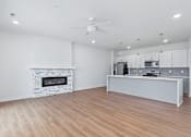 Thumbnail 65 of 77 - Open floor plan with stone fireplace and modern kitchen at The Flats at West Glen Apartments, West Des Moines, 50266