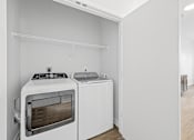 Thumbnail 21 of 52 - A white oven and dishwasher in a kitchen.