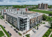 Thumbnail 39 of 40 - an aerial view of an apartment complex in a city at Velocity Apartments, Des Moines