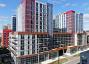 Thumbnail 1 of 13 - an aerial view of a cluster of tall buildings in a city