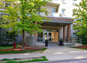 Thumbnail 5 of 17 - The entrance to apartment building number 202 is visible.