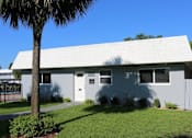 Thumbnail 15 of 15 - a white house with a palm tree in front of it