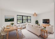 Thumbnail 10 of 49 - A modern living room with a dining table set for two.