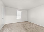 Thumbnail 19 of 29 - A room with a carpeted floor and a window.