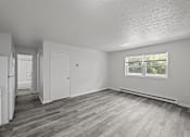 Thumbnail 6 of 16 - A kitchen with white appliances and a grey floor.