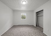 Thumbnail 10 of 16 - A room with a window and a picture on the wall.