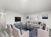 Thumbnail 4 of 16 - A living room with a grey carpet and a white sofa.