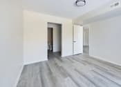 Thumbnail 4 of 23 - A room with a grey floor and white walls.