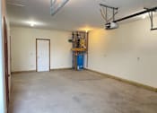 Thumbnail 12 of 53 - A room with a white door and a white ceiling with a light fixture.