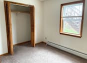 Thumbnail 27 of 53 - A room with a large mirror and a window.