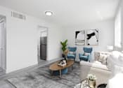 Thumbnail 5 of 12 - a living room with a couch and a table