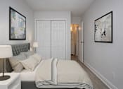 Thumbnail 8 of 21 - a bedroom with a bed and a closet