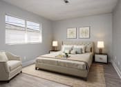 Thumbnail 7 of 21 - a bedroom with a bed and a chair and a window