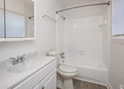 Thumbnail 3 of 21 - a bathroom with a toilet and a tub and a sink
