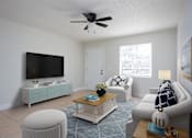 Thumbnail 5 of 12 - a living room with a ceiling fan and a tv