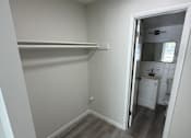 Thumbnail 15 of 23 - A small white bathroom with a toilet and sink.