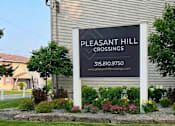 Thumbnail 26 of 26 - A sign for Pleasant Hill Crossings with a phone number and website.