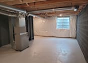 Thumbnail 18 of 26 - A room with a white refrigerator and a window covered with a white sheet.