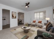 Thumbnail 1 of 17 - a living room with white walls and a ceiling fan